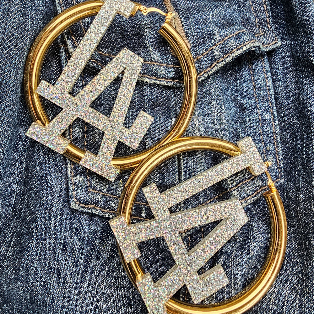 
                      
                        LA Glitter XL Huggie Hoop Earrings
                      
                    